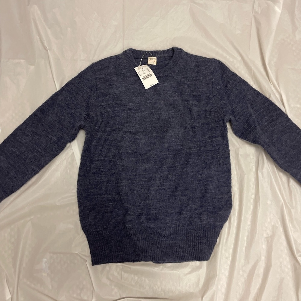 Crew cuts blue sweater with brown circle on the elbows